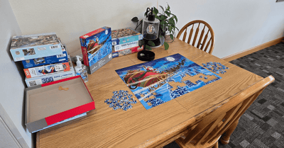 Puzzle setup on a table in a common area.