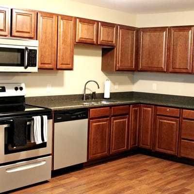 Modern kitchen with wood cabinets and stainless appliances
