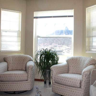 Cozy seating area with plants and natural light