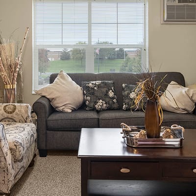 Cozy lounge area with a couch and decor