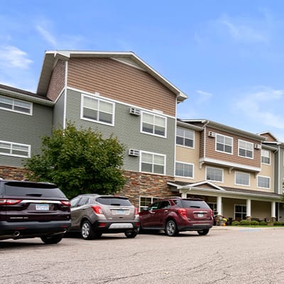 Exterior view of the facility building with parking