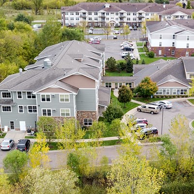 Aerial view of the facility grounds with residential buildings