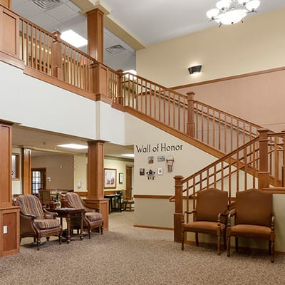 Interior view of a welcoming common area with staircase