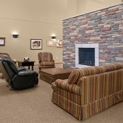 Cozy interior lounge area with seating and fireplace