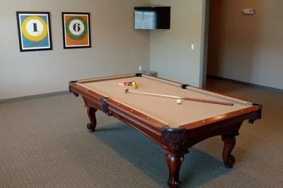 Interior view of a recreation room with a pool table