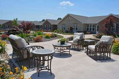 Outdoor seating area surrounded by flowers