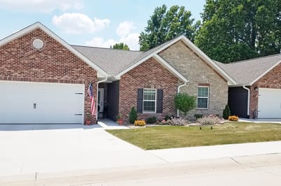 Exterior view of a senior living facility with landscaping