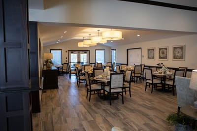 Bright dining room with tables set for meals