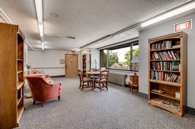 Interior common area with seating and bookshelves