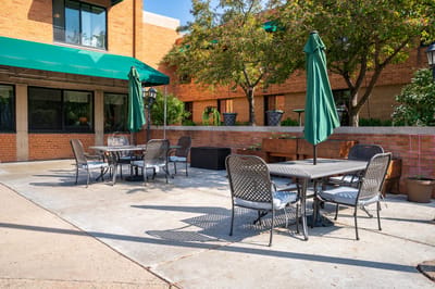 Patio seating area with tables and umbrellas