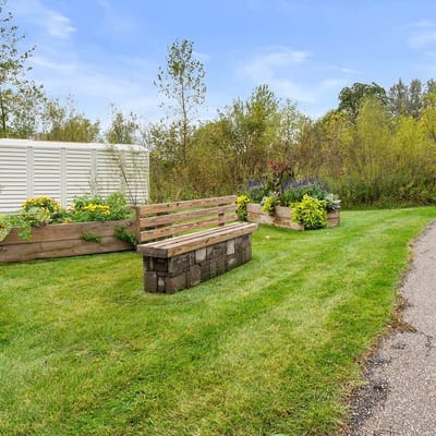 Outdoor seating area with flower beds in a garden