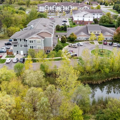 Aerial view of the assisted living facility with surrounding greenery