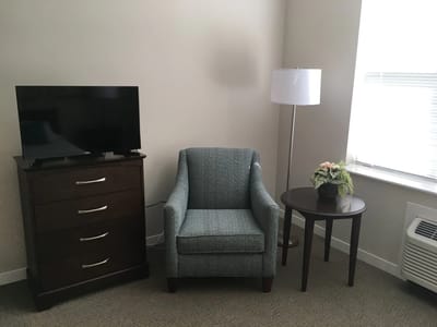 Cozy resident room with furniture and decor