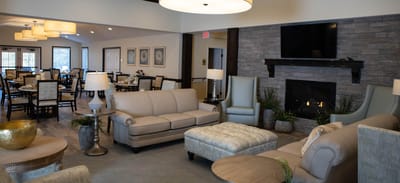 Cozy common area with seating and a fireplace