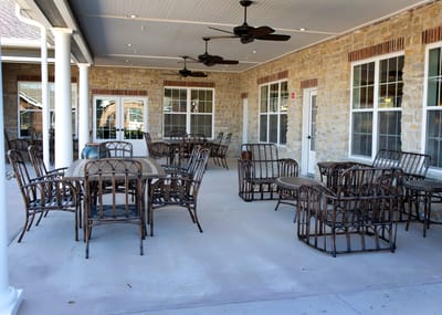 Outdoor seating area with tables and chairs