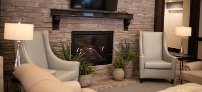 Cozy lounge area with seating and a fireplace