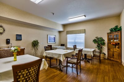 Bright dining area with tables and chairs