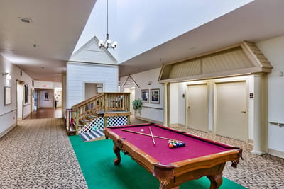 Interior common area with a pool table and seating