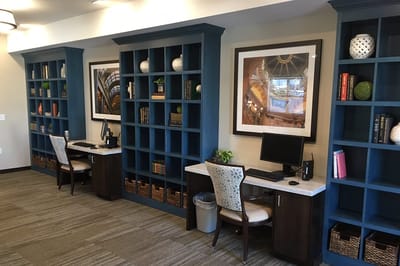 Interior view of a small shared workspace with desks