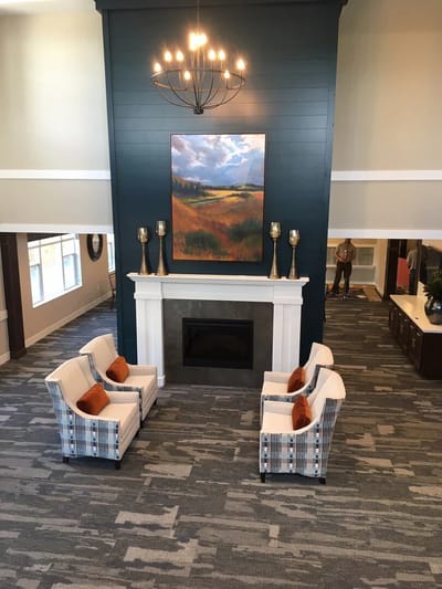 Common area with seating and artwork in a senior living facility
