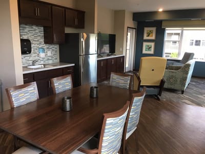 Bright interior with dining table and lounge area