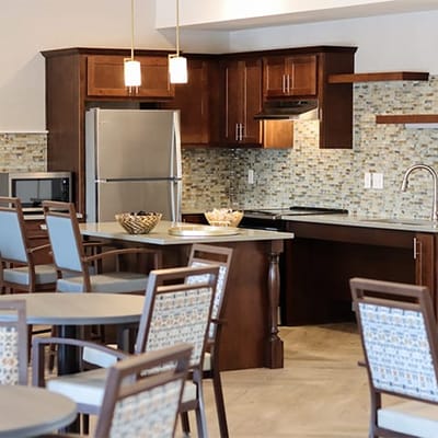 Interior view of a modern kitchen area with dining tables