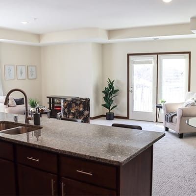 Bright and spacious living room area with open kitchen