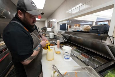 Chef preparing food in a facility kitchen