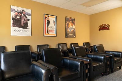 Seating area with vintage movie posters on the wall