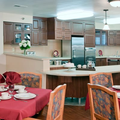 Bright dining area with tables set for residents