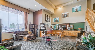 Bright common area with comfortable seating and kitchenette