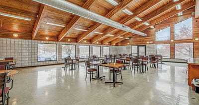Interior view of a dining room with wooden ceiling