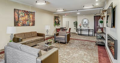 Bright and welcoming common area with seating and decor