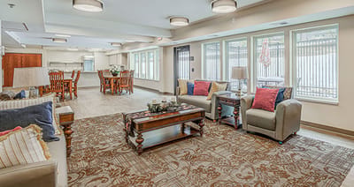 Bright common area with seating and dining space
