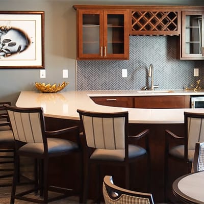 Interior view of a common area with seating and a kitchen