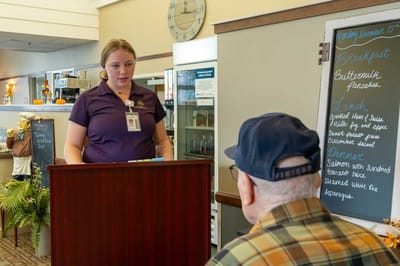Staff member interacting with a resident in a common area