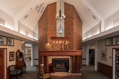 Interior view of a cozy common area with fireplace