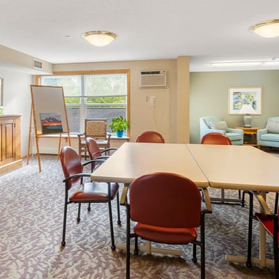 Bright common area with tables and chairs