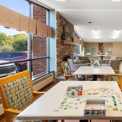 Common area with residents playing puzzles
