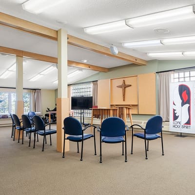 Interior activity room with chairs arranged for a gathering