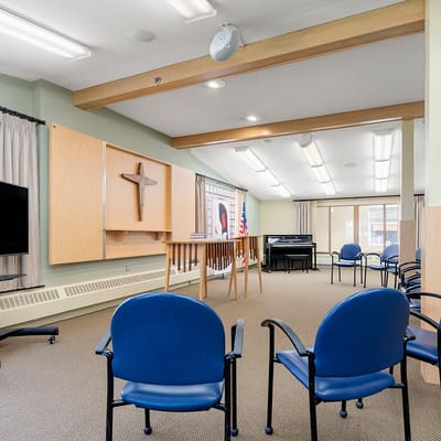 Bright activity room with seating and instruments