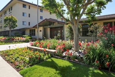 Beautiful garden with colorful flowers in front of the facility.