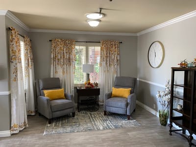 Cozy lounge area with comfortable chairs and decor.