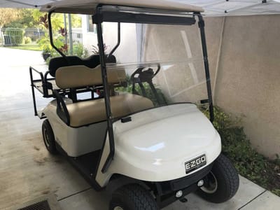 Golf cart parked outside facility