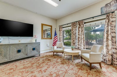 Common area with seating and television.