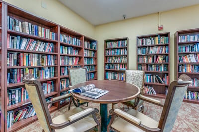 Cozy reading area with bookshelves and seating