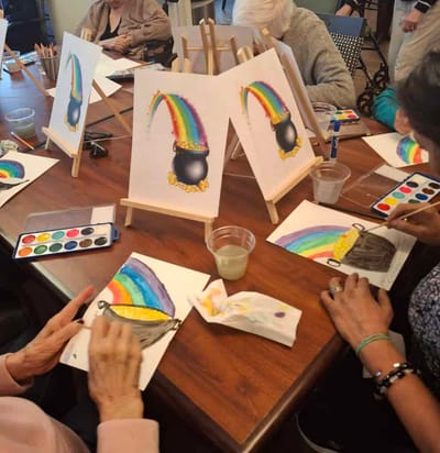 Residents engaging in a creative painting activity.