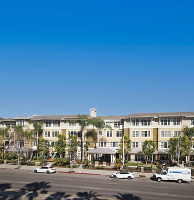 Exterior view of assisted living facility with landscaping