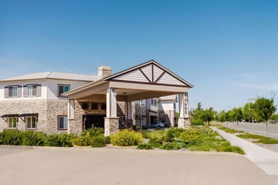Exterior view of the facility with landscaping.