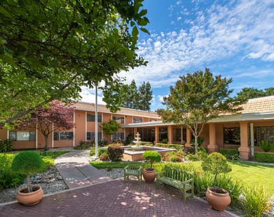 Exterior view of facility with landscaped garden